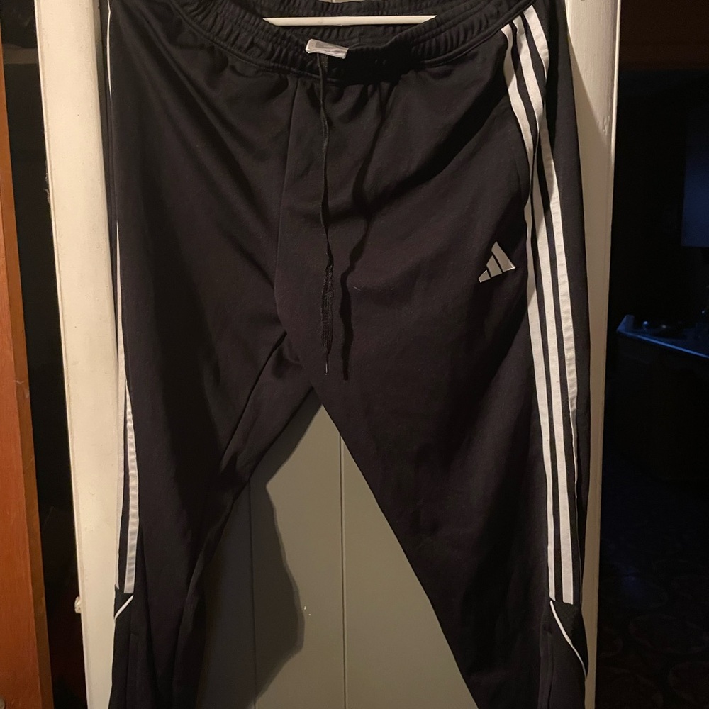Adidas women’s Black Joggers with White Stripes